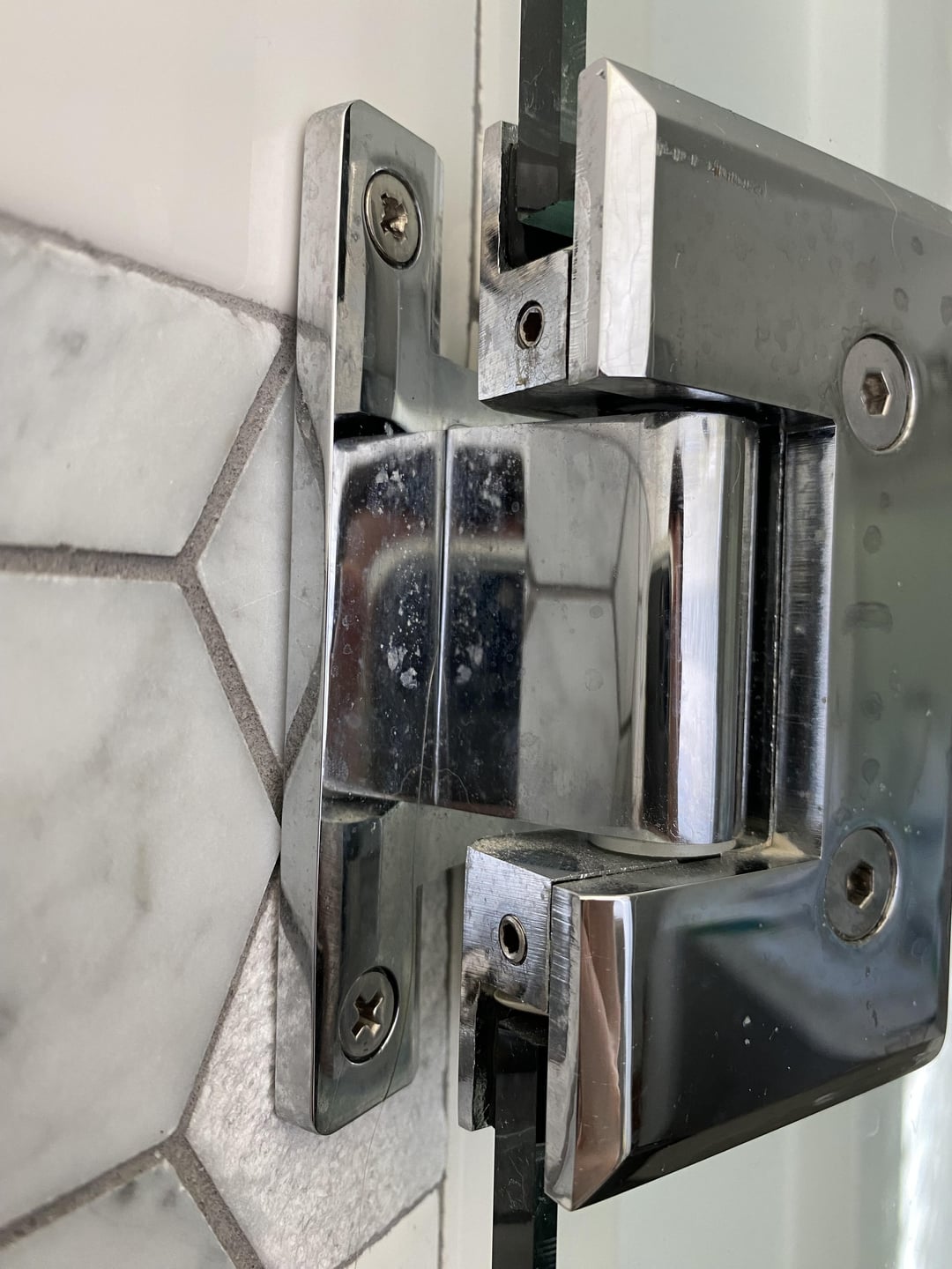 How to Adjust a Shower Door Hinge